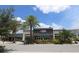 Community fitness center with large windows and lush landscaping at 13676 Mcmillan Dr, Orlando, FL 32827
