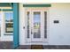 Inviting home entrance with sidelights, stylish address plate, and welcome mat at 13676 Mcmillan Dr, Orlando, FL 32827