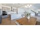 Open kitchen and dining area with modern lighting and stainless steel appliances at 13676 Mcmillan Dr, Orlando, FL 32827