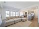 Bright living room with a large sectional sofa and views to the kitchen at 13676 Mcmillan Dr, Orlando, FL 32827