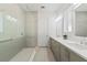 Elegant bathroom with a spacious glass shower, double sinks, and a clean, modern design at 13759 Mommsen Ave, Orlando, FL 32827
