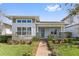 Charming single-story home with well-manicured lawn and inviting front porch, showcasing curb appeal at 13759 Mommsen Ave, Orlando, FL 32827