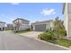 Detached two-car garage featuring manicured landscaping and a driveway; located in a residential neighborhood at 13759 Mommsen Ave, Orlando, FL 32827