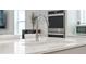 Close-up of a modern kitchen featuring a sink with a stylish faucet and quartz countertops at 13759 Mommsen Ave, Orlando, FL 32827