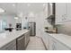 Well-equipped kitchen with island, stainless steel appliances, and sleek white cabinetry at 13759 Mommsen Ave, Orlando, FL 32827