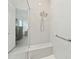 Modern walk-in shower with white subway tile, a built-in bench, and sleek fixtures at 13759 Mommsen Ave, Orlando, FL 32827