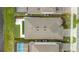 Aerial view of a home showcasing the roof, backyard with patio, and proximity to a water feature at 13916 Destin Beach Ln, Orlando, FL 32827