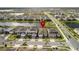 Aerial view of a home in a lakeside community with well-maintained landscaping and serene water views at 13916 Destin Beach Ln, Orlando, FL 32827