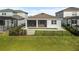 Aerial view of the backyard features a screened patio and well-maintained landscaping at 13916 Destin Beach Ln, Orlando, FL 32827