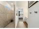 Modern bathroom features a tiled walk-in shower and contemporary fixtures at 13916 Destin Beach Ln, Orlando, FL 32827