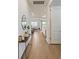 Inviting hallway features wood-look tile flooring and flows seamlessly into the open-concept living spaces at 13916 Destin Beach Ln, Orlando, FL 32827