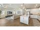 Open-concept living space with a modern kitchen and comfortable seating area at 13916 Destin Beach Ln, Orlando, FL 32827