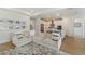 Comfortable living room with open kitchen, stainless steel appliances and tile backsplash at 13916 Destin Beach Ln, Orlando, FL 32827