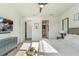 Bright main bedroom with a large window, stylish furnishings, and a serene atmosphere at 13916 Destin Beach Ln, Orlando, FL 32827