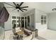 Spacious screened patio with comfortable seating and view of lake and neighboring homes at 13916 Destin Beach Ln, Orlando, FL 32827