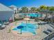 Gathering-friendly splash pad with lounge chairs and pool in a well-maintained community area at 13916 Destin Beach Ln, Orlando, FL 32827