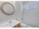 Bathroom featuring tiled shower, vanity and updated fixtures at 14136 Magnolia Glen Cir, Orlando, FL 32828