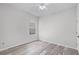 Bright bedroom featuring updated flooring, ceiling fan and a large window at 14136 Magnolia Glen Cir, Orlando, FL 32828