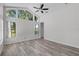 Bright bedroom with vaulted ceiling and large windows providing abundant natural light and peaceful views at 14136 Magnolia Glen Cir, Orlando, FL 32828