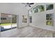 Bright bedroom with ceiling fan, sliding glass doors to patio, and picturesque backyard views at 14136 Magnolia Glen Cir, Orlando, FL 32828