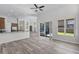 Open living area with floor-to-ceiling windows and sliding glass doors that seamlessly connects indoor and outdoor spaces at 14136 Magnolia Glen Cir, Orlando, FL 32828