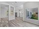 Bright living room featuring an open layout, large windows, and modern flooring at 14136 Magnolia Glen Cir, Orlando, FL 32828