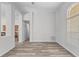 Spacious room featuring laminate floors, neutral walls, and natural light streaming in from the large windows at 14136 Magnolia Glen Cir, Orlando, FL 32828