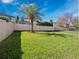 Spacious backyard features lush green grass, new wood fencing, and beautiful landscaping at 14554 Winter Stay Dr, Winter Garden, FL 34787
