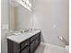 Bathroom featuring modern fixtures, vanity with granite counters, and neutral wall color at 14554 Winter Stay Dr, Winter Garden, FL 34787