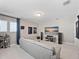 Bright bonus room offering an entertainment area with a TV, speakers, and sectional sofa at 14554 Winter Stay Dr, Winter Garden, FL 34787