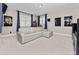 Spacious bonus room with neutral carpet, an entertainment center, and a comfortable sectional sofa at 14554 Winter Stay Dr, Winter Garden, FL 34787