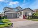 Beautiful two-story home featuring a spacious two-car garage, landscaped front yard, and welcoming front porch at 14554 Winter Stay Dr, Winter Garden, FL 34787