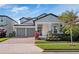 Charming two-story home with well-maintained landscaping, a two-car garage, and covered front porch at 14554 Winter Stay Dr, Winter Garden, FL 34787