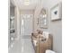 Elegant foyer featuring a stylish bench, decorative mirror, and chandelier that welcomes you into the home at 14554 Winter Stay Dr, Winter Garden, FL 34787