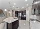 Open kitchen with granite counters, dark wood cabinets, and stainless steel appliances at 14554 Winter Stay Dr, Winter Garden, FL 34787