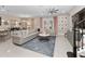 Spacious living room featuring a large sectional sofa, stylish rug, and open layout to the dining area at 14554 Winter Stay Dr, Winter Garden, FL 34787