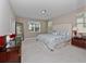Spacious main bedroom with a large window and plush carpet, creating a relaxing retreat at 14554 Winter Stay Dr, Winter Garden, FL 34787