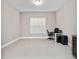 Minimalist office space with tile flooring, neutral walls, and ample natural light at 14554 Winter Stay Dr, Winter Garden, FL 34787