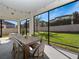 Screened patio with a dining table and chairs offers a peaceful outdoor living space at 14554 Winter Stay Dr, Winter Garden, FL 34787