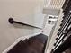 Elegant staircase with dark wood steps, iron railings, and white trim, leading to the upper level at 14554 Winter Stay Dr, Winter Garden, FL 34787