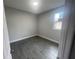 Cozy bedroom features neutral paint, tile flooring, and a window providing natural light at 1463 1St St, Orlando, FL 32824