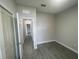 Bedroom space with tile flooring and a view down the hallway toward another bedroom at 1463 1St St, Orlando, FL 32824