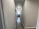Hallway with tile floors that connects various rooms within the home at 1463 1St St, Orlando, FL 32824