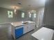 Modern kitchen with a center island, quartz countertops, stainless steel appliances, and pendant lighting at 1463 1St St, Orlando, FL 32824