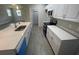 Bright kitchen features stainless steel appliances, white cabinets, and a large island at 1463 1St St, Orlando, FL 32824