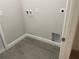 Laundry room area with washer and dryer hookups and tiled flooring at 1463 1St St, Orlando, FL 32824