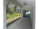 Covered patio overlooking a grassy backyard, perfect for outdoor relaxation and entertaining at 1463 1St St, Orlando, FL 32824