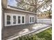 A lovely backyard deck overlooking the fenced yard and mature trees at 1513 Pinecrest Pl, Orlando, FL 32803