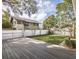An inviting backyard deck overlooking the fenced yard and mature trees at 1513 Pinecrest Pl, Orlando, FL 32803