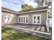 Spacious deck leading to a well-maintained yard, perfect for outdoor relaxation and entertainment at 1513 Pinecrest Pl, Orlando, FL 32803